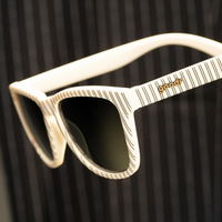 goodr "Clad to the Bone" Sunglasses  Closeup on a Black Striped Background